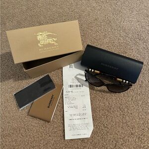 Burberry sunglasses, original receipt included.